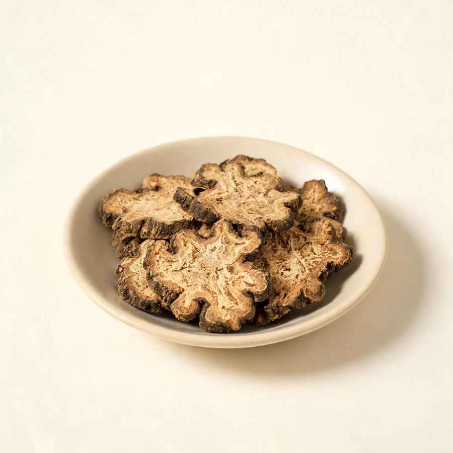 Dried Chuan Xiong rhizome arranged in a shallow bowl