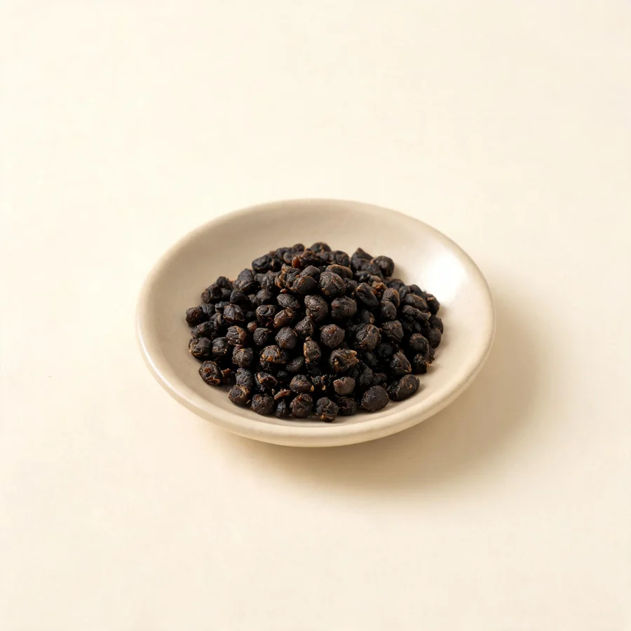 Dried Dan Dou Chi fermented seed arranged in a shallow bowl