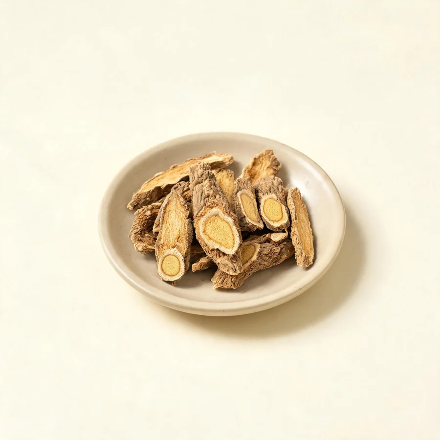 Dried Dang Gui root arranged in a shallow bowl