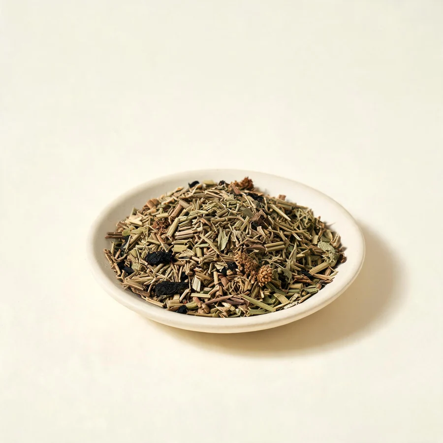 Dried Jing Jie aerial parts arranged in a shallow bowl