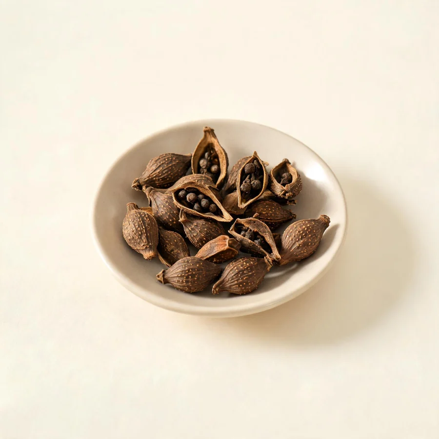 Dried Lian Qiao fruit arranged in a shallow bowl