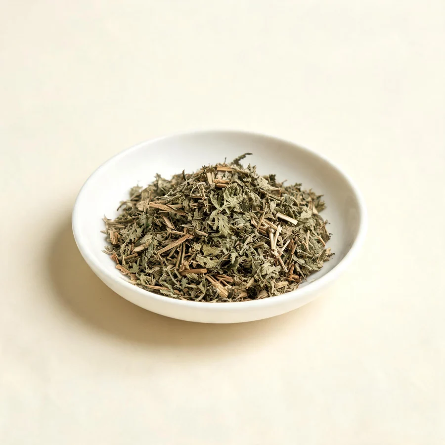 Dried Qing Hao aerial parts arranged in a shallow bowl