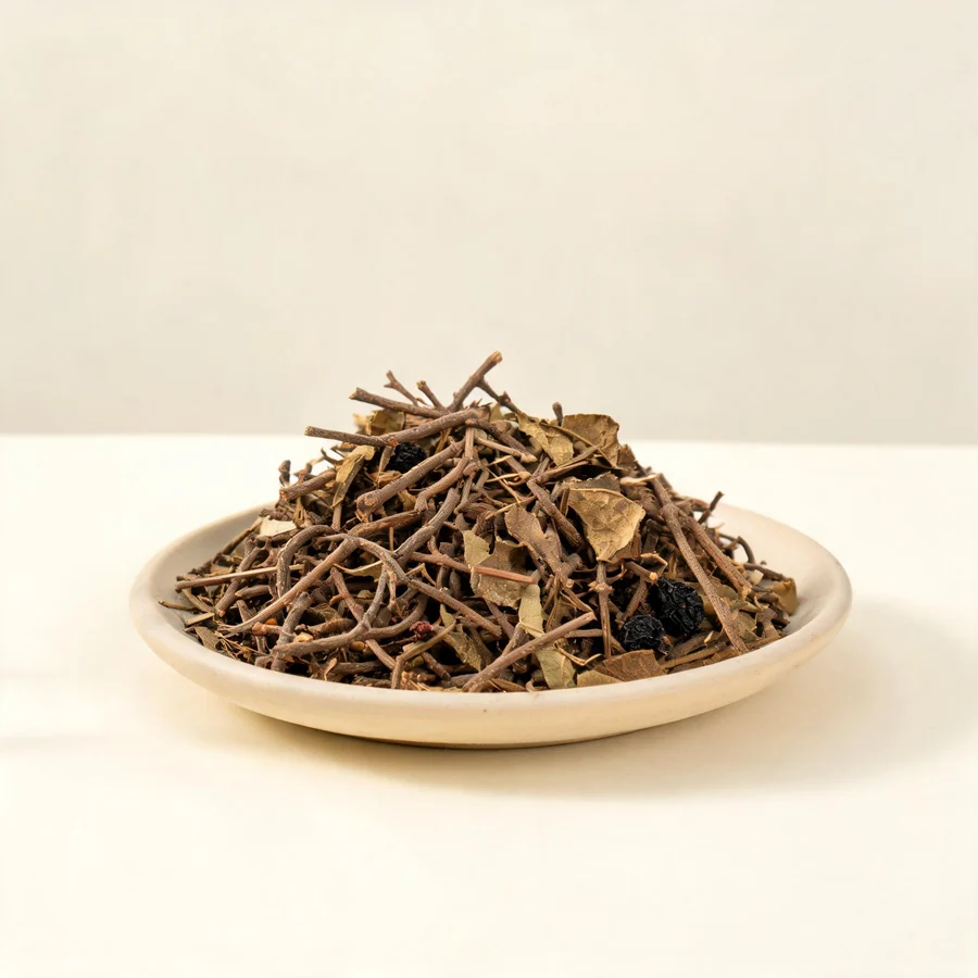 Dried Sang Ji Sheng stem and leaf arranged in a shallow bowl