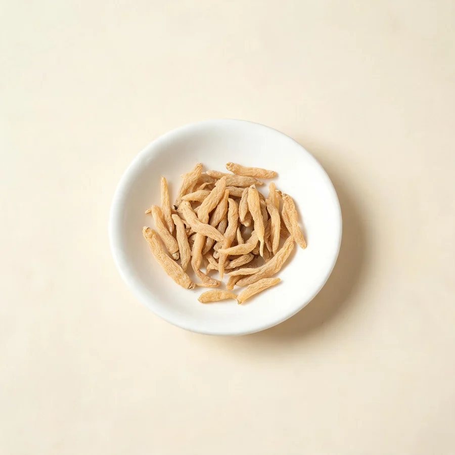 Dried Tai Zi Shen root arranged in a shallow bowl