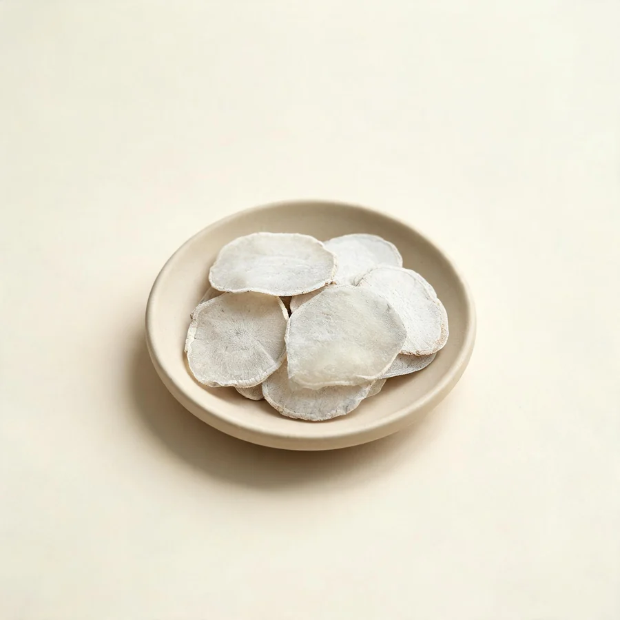 Dried Tian Nan Xing tuber arranged in a shallow bowl