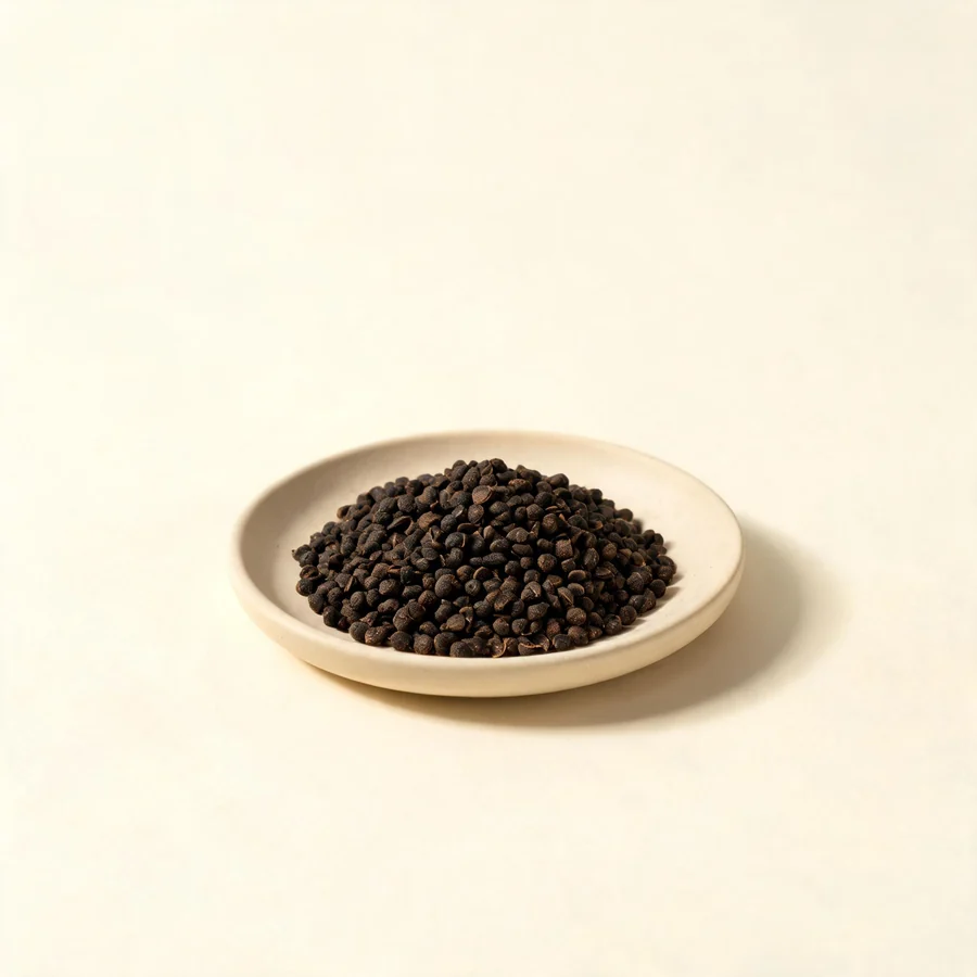 Dried Wu Ling Zhi processed faeces arranged in a shallow bowl
