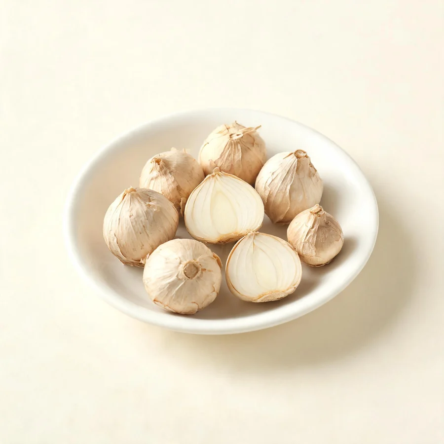 Dried Xie Bai bulb arranged in a shallow bowl