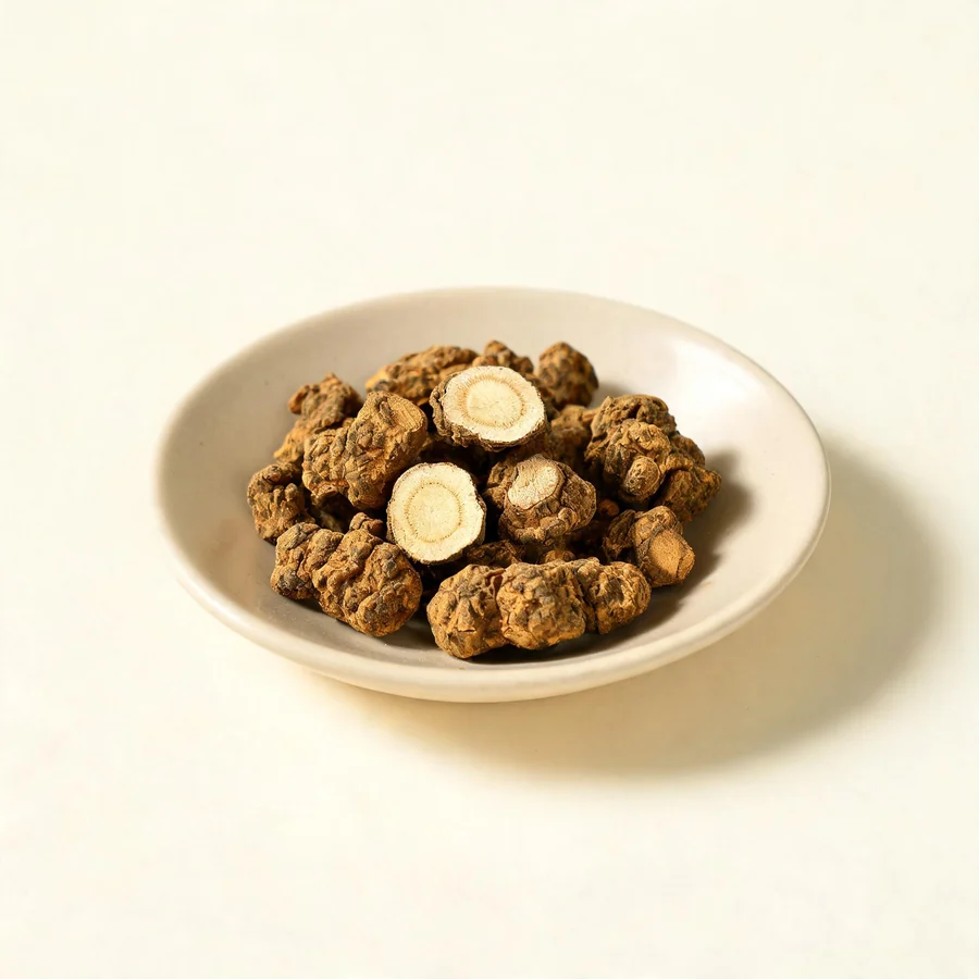 Dried Yan Hu Suo rhizome arranged in a shallow bowl
